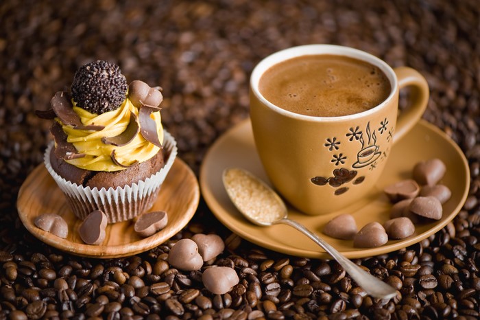 Cupcake and coffee with chocolate hearts