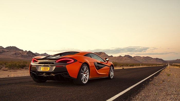 Orange McLaren 570S Supercar on Desert Road