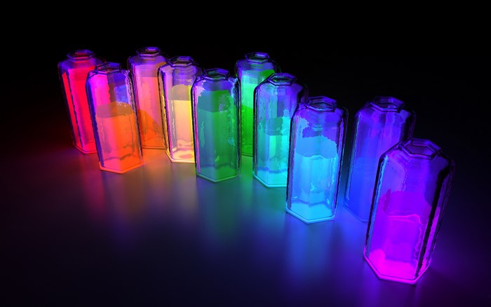 Rainbow colored bottles with glowing liquid