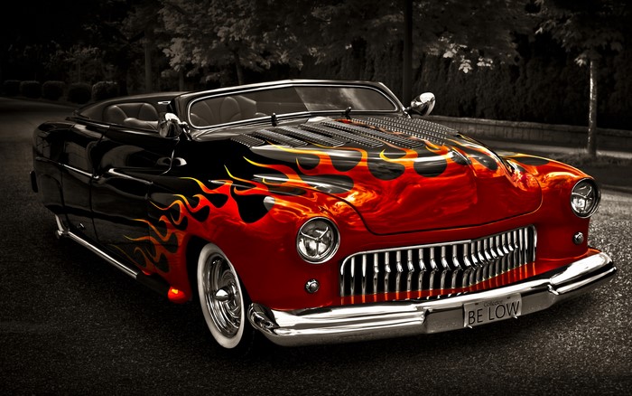 Red and black Mercury convertible with flame decals