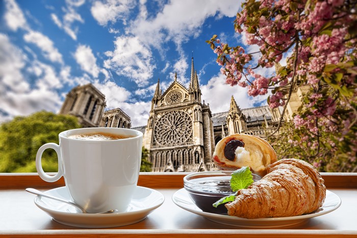 Breakfast with Coffee and Croissant in front of Notre Dame Cathedral, Paris