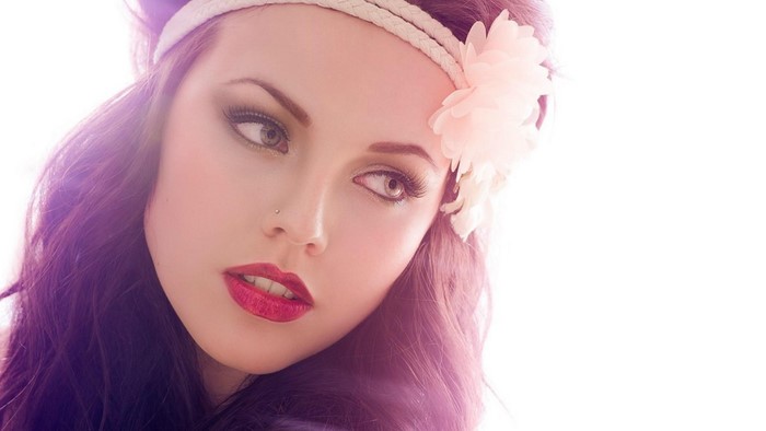 Woman with flower headband and makeup