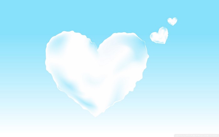 Heart-shaped clouds in a blue sky