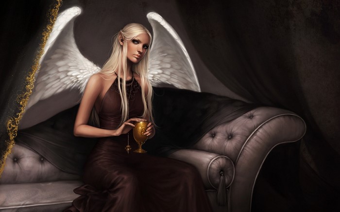 Angel holding a golden chalice on a couch