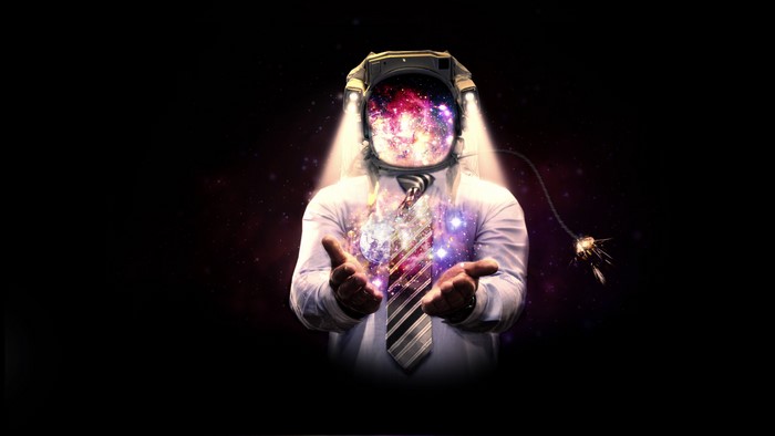 Astronaut in a suit with galaxy in helmet