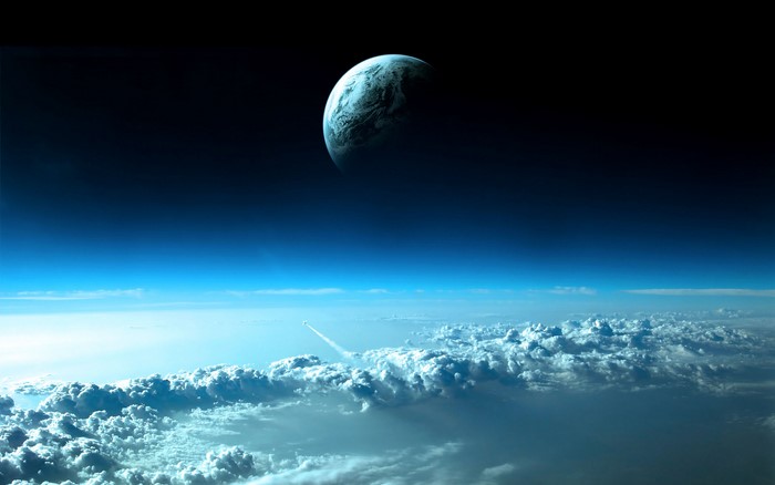 Earth and clouds from space with a rocket