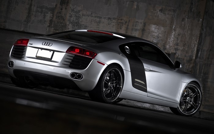 Silver Audi R8 parked in a concrete garage