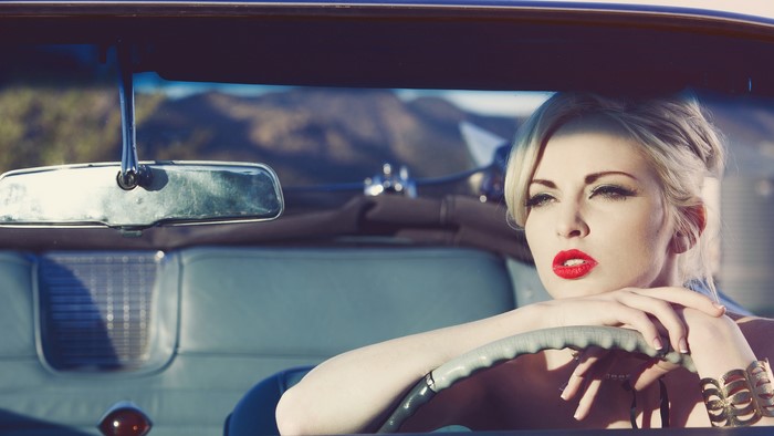 Woman in vintage car