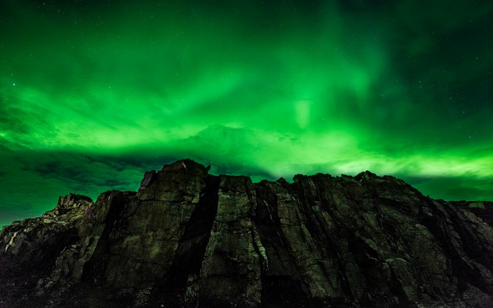 Aurora Borealis over rocky mountains