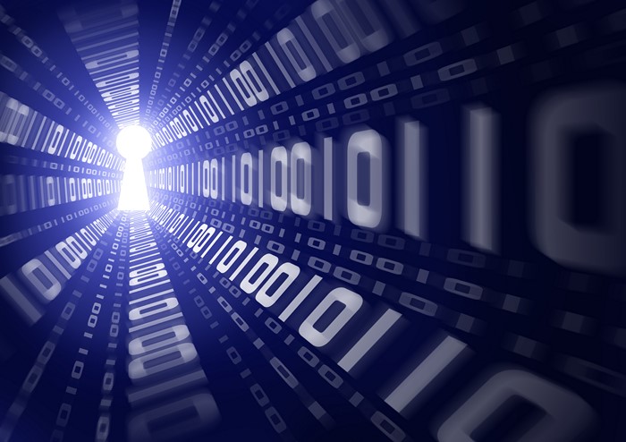 Tunnel of binary code leading to a keyhole
