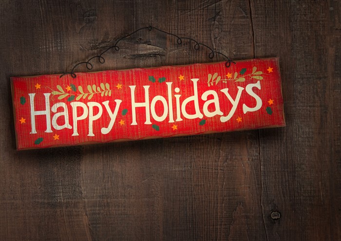 Happy Holidays sign on wooden background