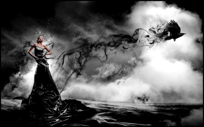 Woman in black dress with smoke and crow