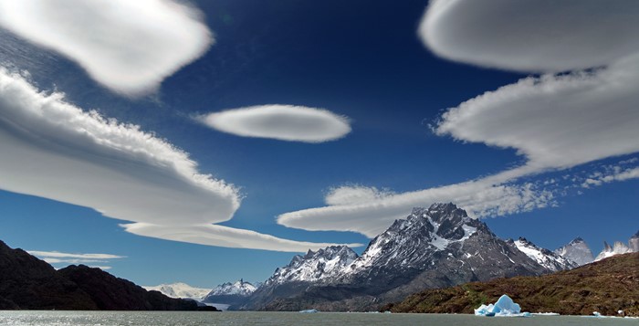 Lenticular clouds over mountains and lake in Patagonia, Chile