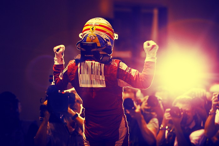 Fernando Alonso celebrating with fists raised