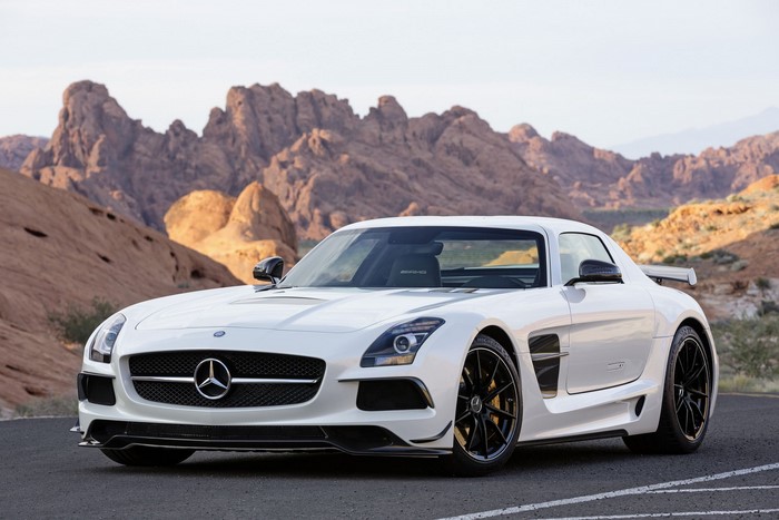 White Mercedes-Benz SLS AMG GT in a desert landscape