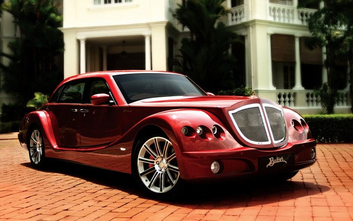 Red Buford car parked in front of a mansion