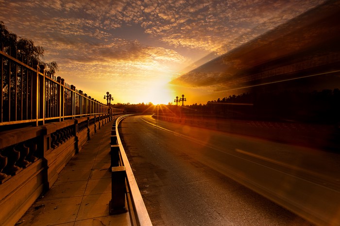 Road on a bridge at sunset