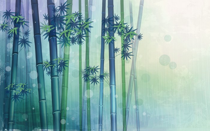Bamboo stalks with green leaves and bokeh effect