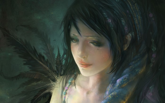 Artistic portrait of a woman with dark hair and feathers
