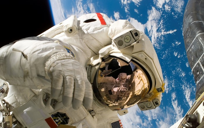 Astronaut in space with Earth in background