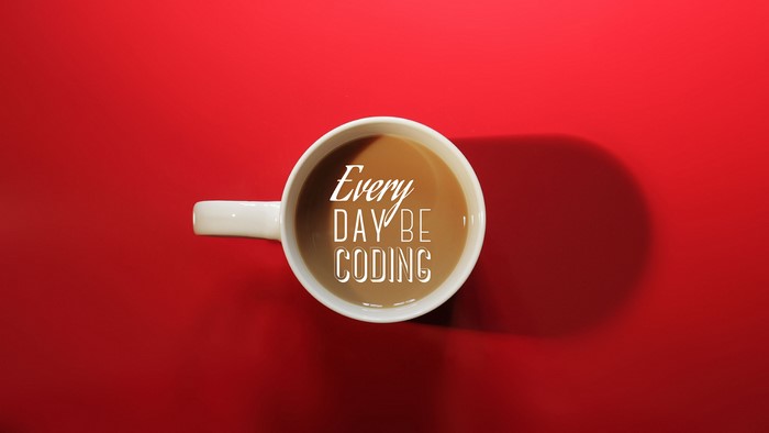 Coffee cup with "Every Day Be Coding" text