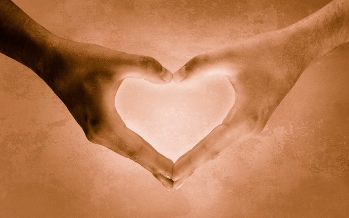 Two hands forming a heart shape