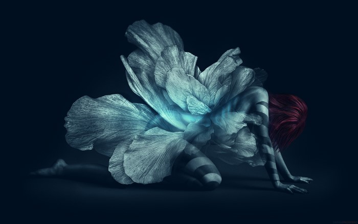 Woman merging with a large flower
