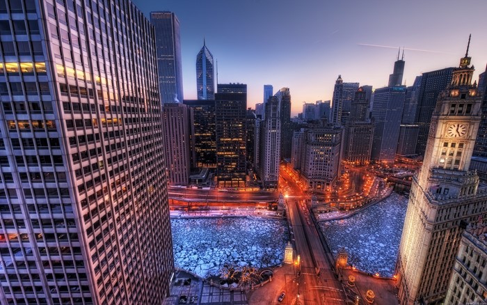 Chicago cityscape at dusk with frozen river