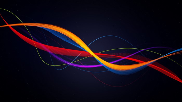 Abstract colorful light streaks on dark background