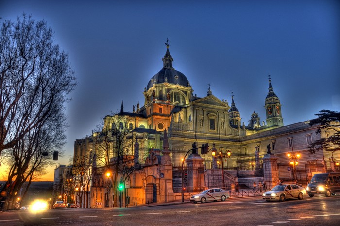 Almudena Cathedral at dusk with cars