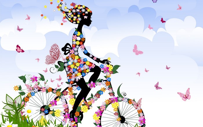 Girl on a bicycle decorated with flowers and butterflies