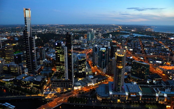 Melbourne cityscape at night with skyscrapers and lights