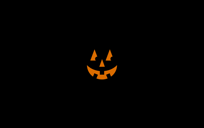 Halloween pumpkin face on black background