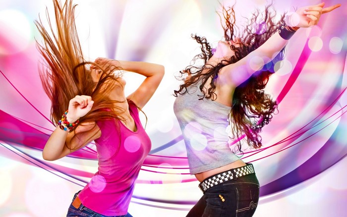 Two women dancing with colorful background