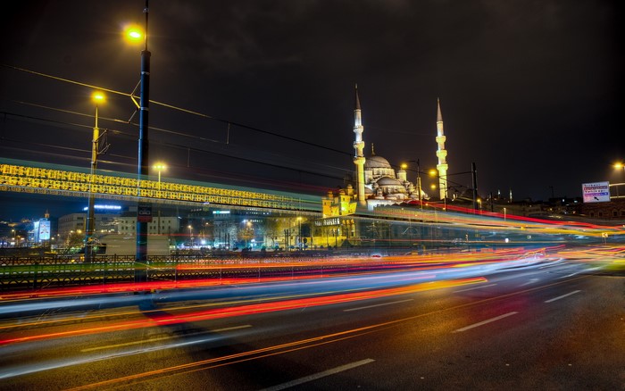 Night time-lapse of a mosque in Istanbul with light trails