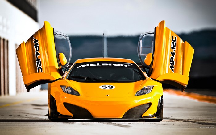 Orange McLaren MP4-12C race car with doors open