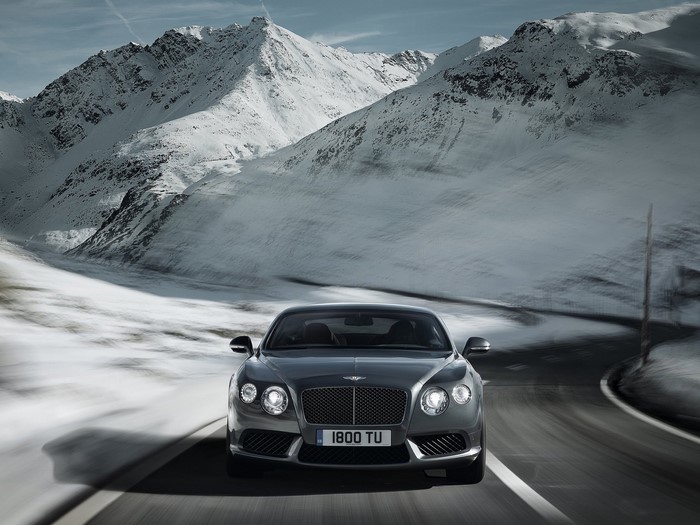 Bentley driving on a snowy mountain road