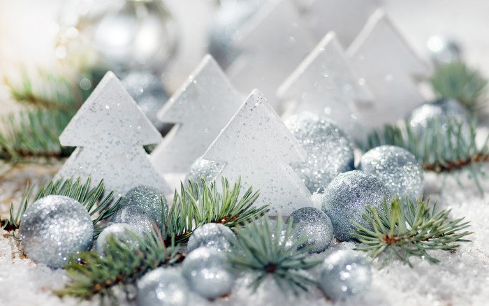 Christmas ornaments and trees on snow
