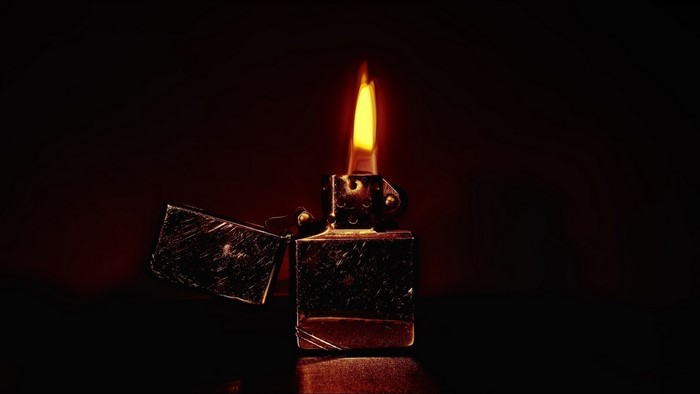 Lighter with flame