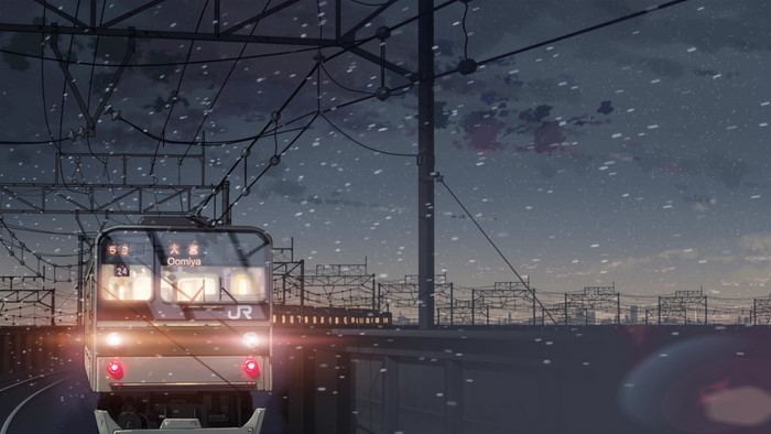 Train arriving at Omiya station in snowy weather