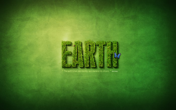 EARTH text made of grass with a butterfly