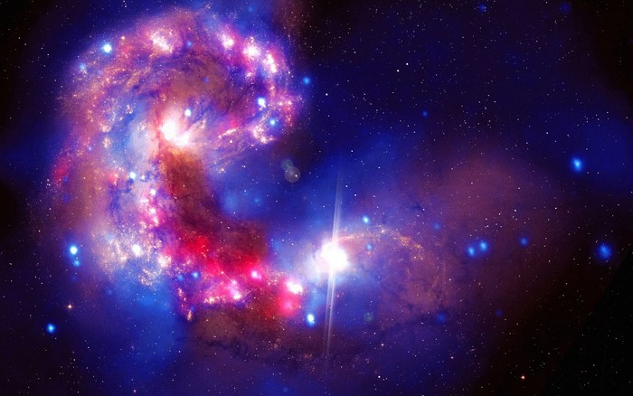 Colliding galaxies with colorful nebulae and stars