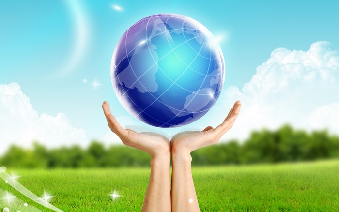 Hands holding a glowing Earth globe