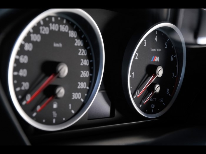 BMW M car dashboard with speedometer and tachometer