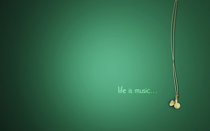 Life is Music headphones on green background