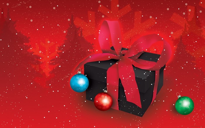 Christmas gift with ornaments and falling snow
