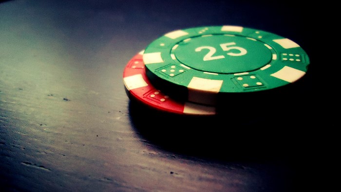 Poker chips on a dark surface