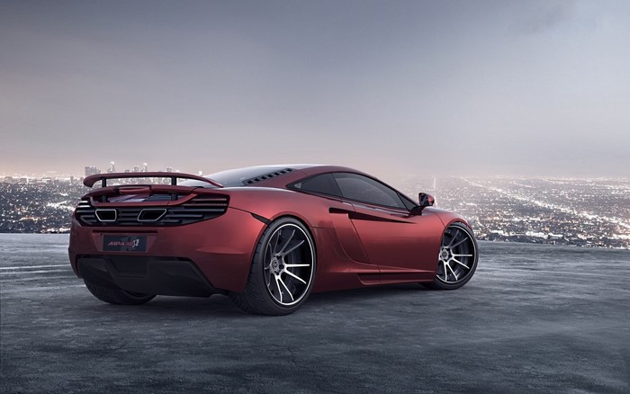 Red McLaren MP4-12C sports car overlooking city