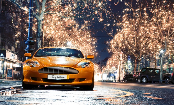 Orange Aston Martin Vanquish with Christmas Lights