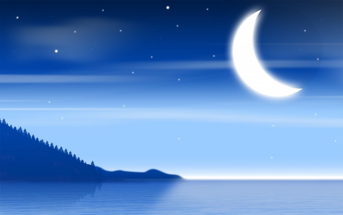 Crescent moon over a calm body of water with a forest